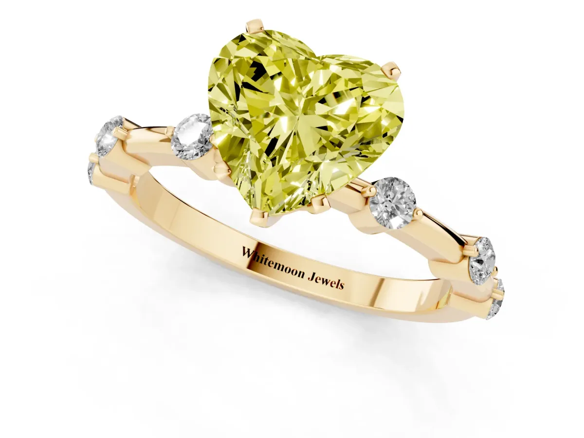 Fancy Yellow Heart Cut Solitaire Diamond Ring with Bezel Set Side Stones and Prong Setting Yellow gold
