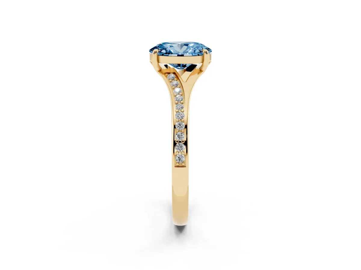 Fancy Blue Oval Cut Diamond Solitaire Ring with Pavé Band and Prong Setting Yellow gold