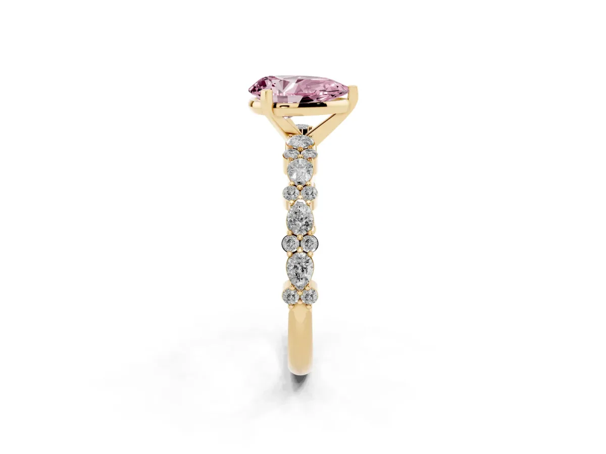 Fancy Pink Pear Cut Diamond Side Stone Solitaire Ring with Round and Four-Prong Setting Yellow gold