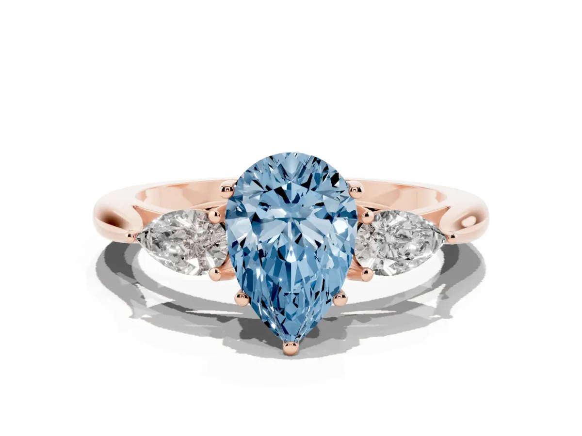 Fancy Blue Three-Stone Pear Cut Brilliant Diamond Solitaire Ring with Tapered Band and Four-Prong Setting Rose gold