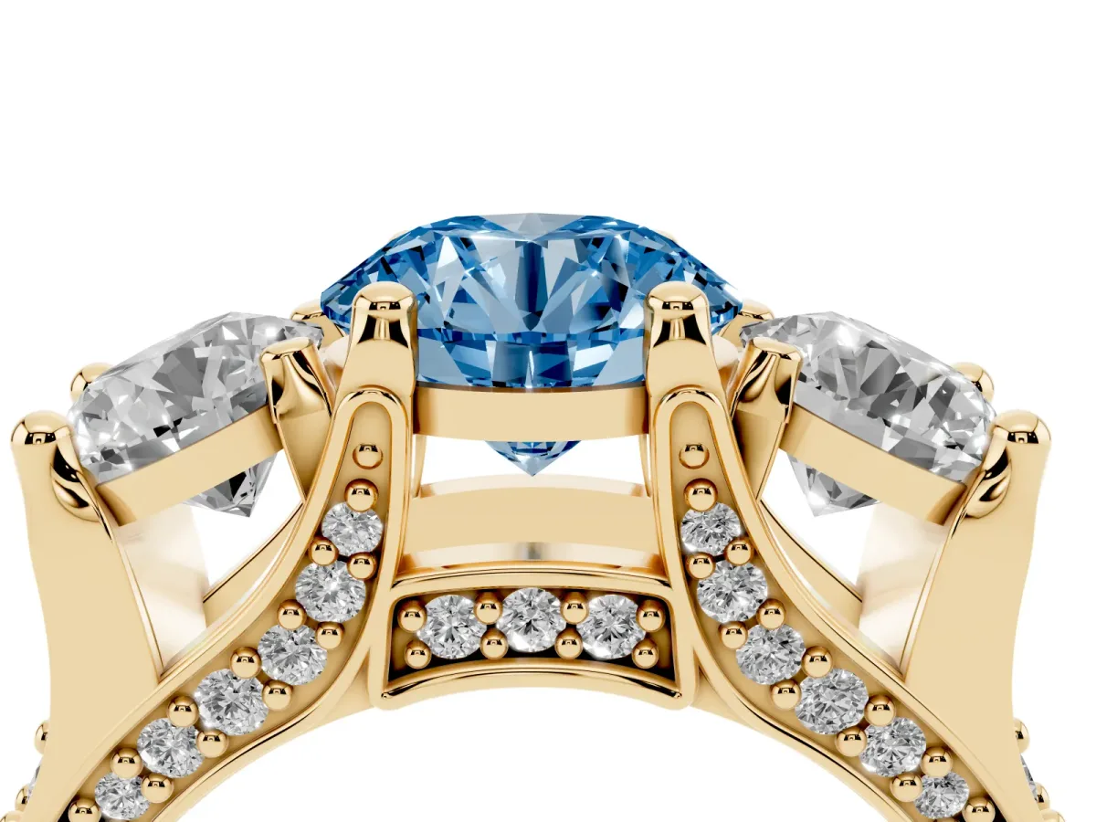 Fancy Blue Round Cut Diamond Three-Stone Ring with Channel Set Band and Four-Prong Setting Yellow gold