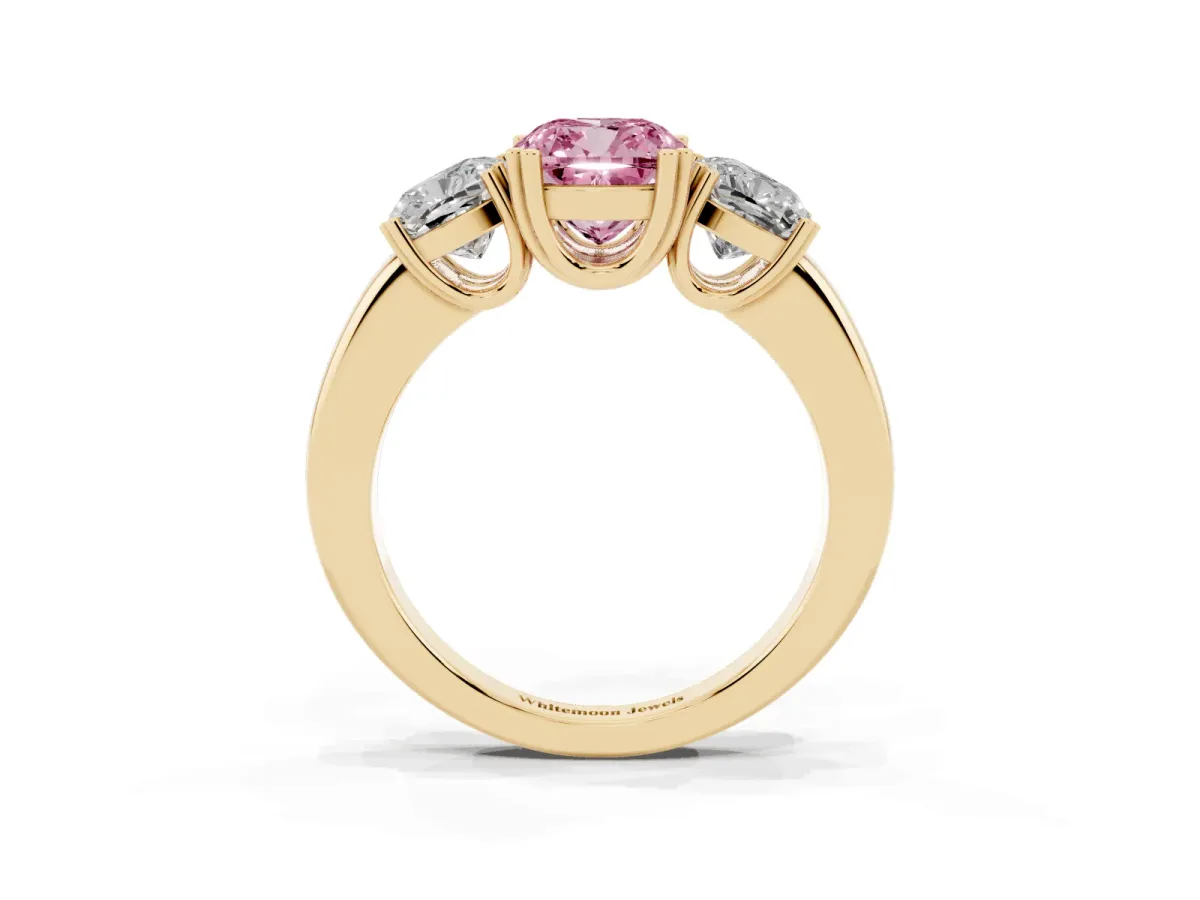 Fancy Pink Three-Stone Cushion Cut Cut Diamond Ring with Channel Set Band and Four-Prong Setting Yellow gold