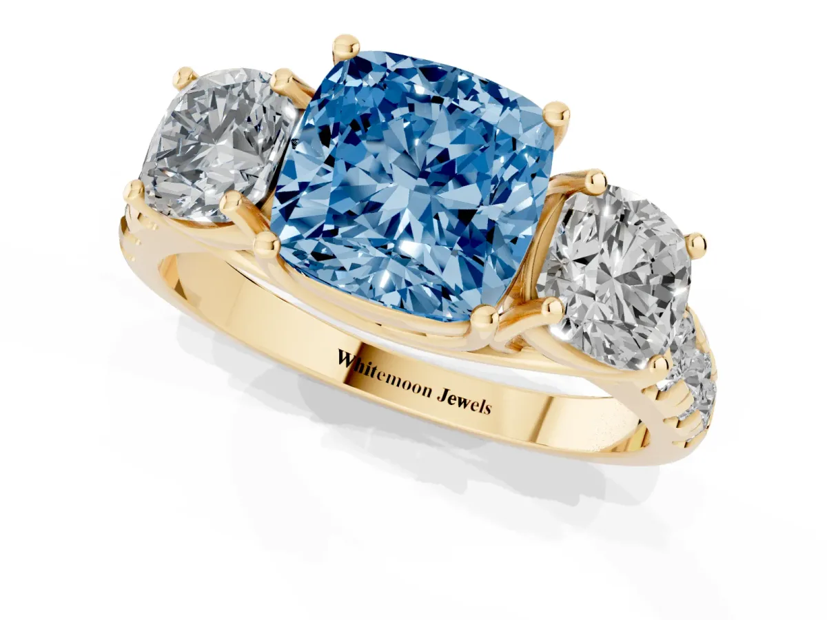 Fancy Blue Three-Stone Cushion Cut Diamond Pavé Band with Prong Setting Yellow gold