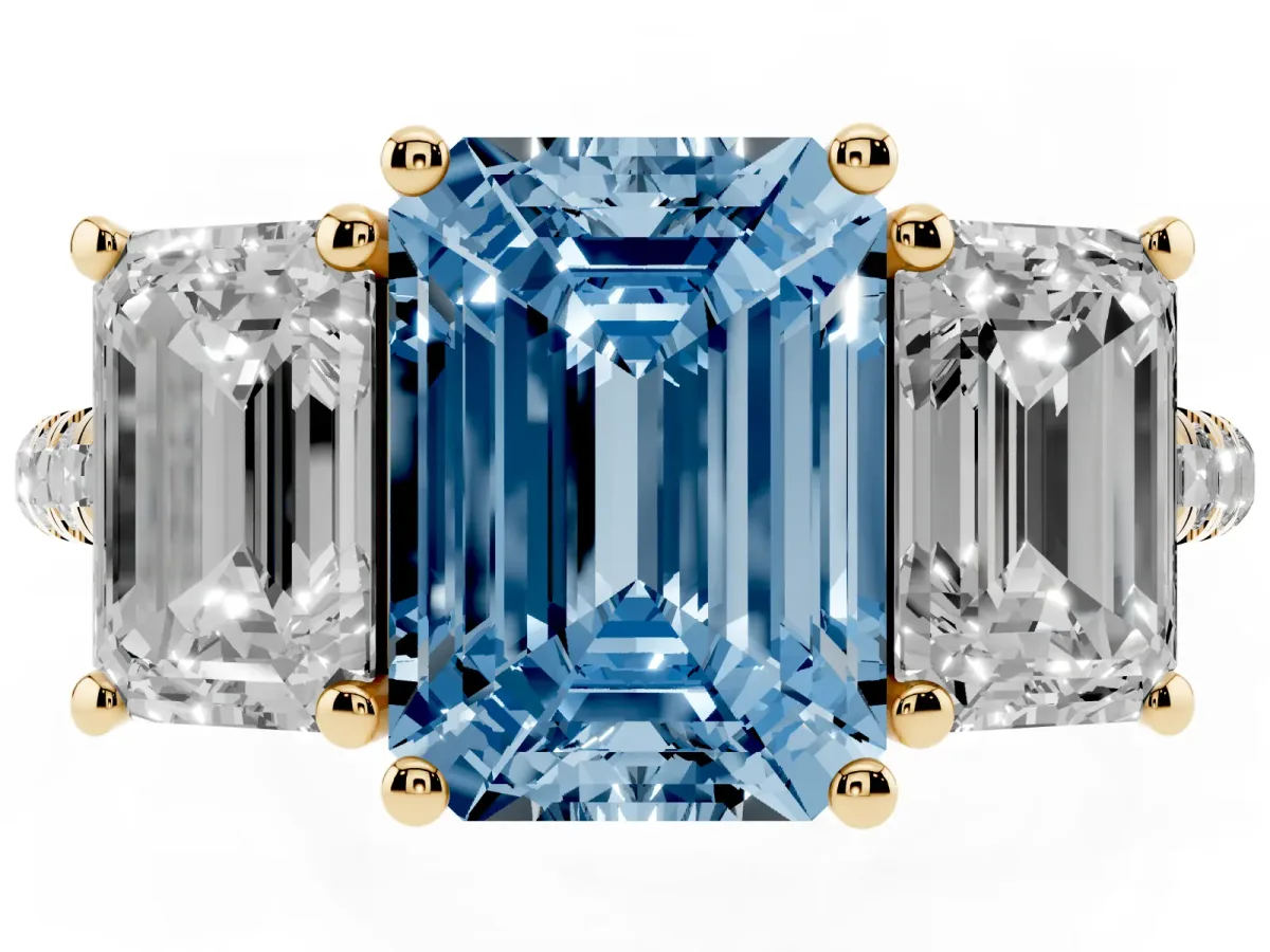 Fancy Blue Three-Stone Emerald Cut Diamond Ring with Round Pavé Band and Prong Setting Yellow gold