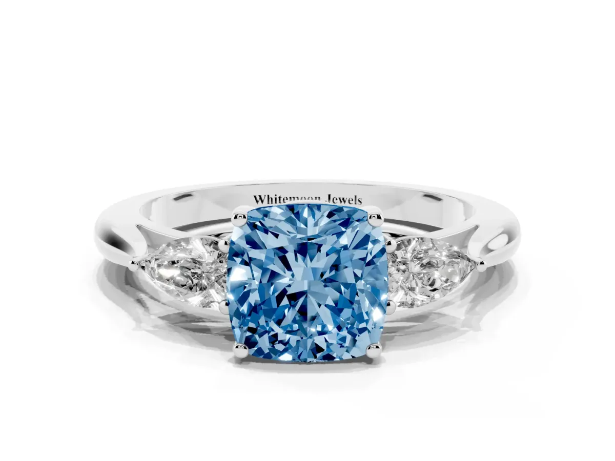 Fancy Blue Three-Stone Cushion Cut Brilliant Diamond Solitaire Ring with Tapered Band and Four-Prong Setting Silver