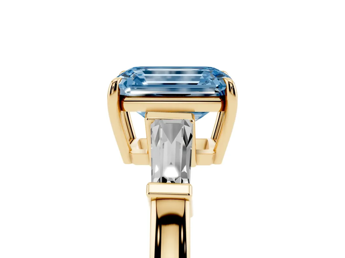 Fancy Blue Emerald Cut Diamond Three-Stone Ring with Tapered Baguette Side Stones and Prong Setting Yellow gold