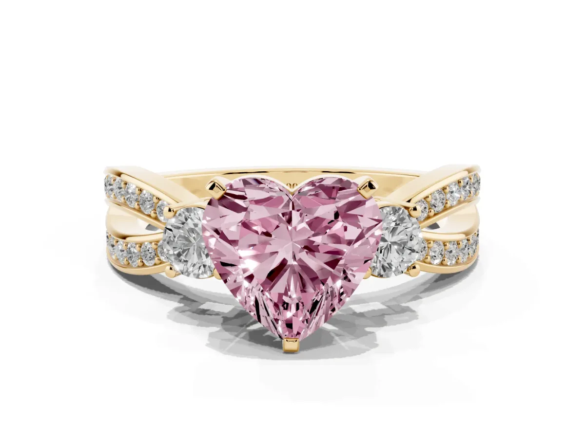 Fancy Pink Three-Stone Heart Cut Cut Diamond Twist Band with Prong Setting Yellow gold