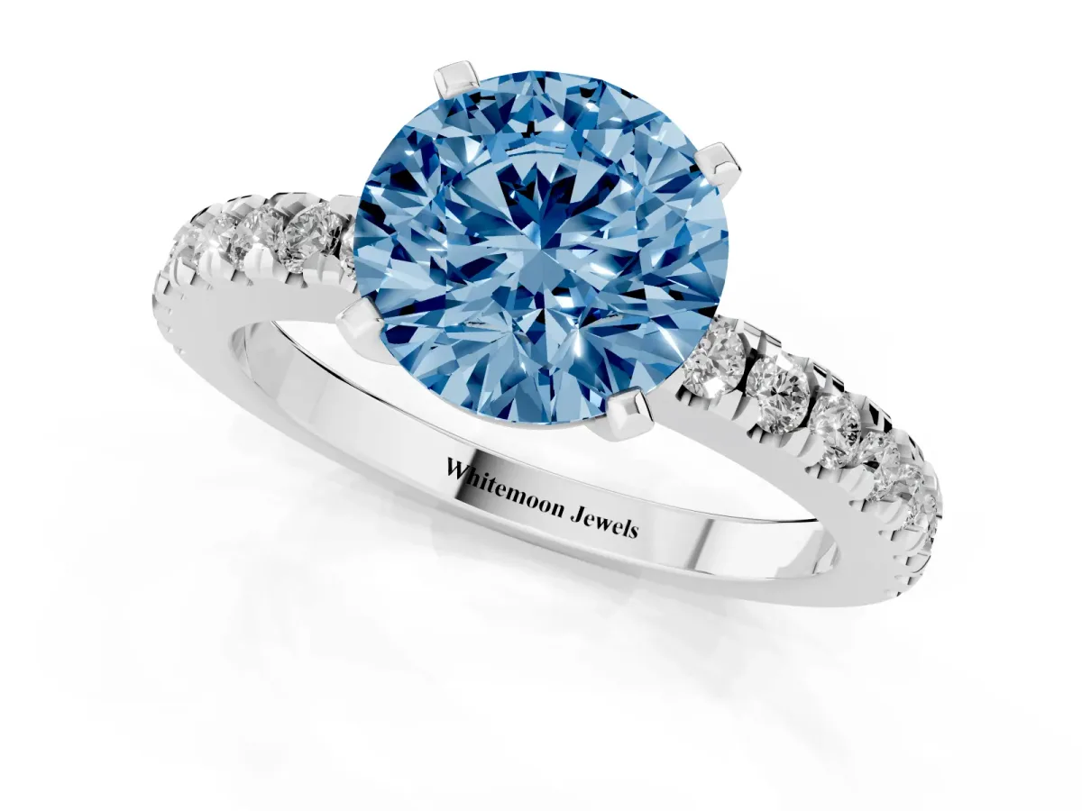 Fancy Blue Round Cut Solitaire Diamond with Pavé Band and Four-Prong Setting Silver