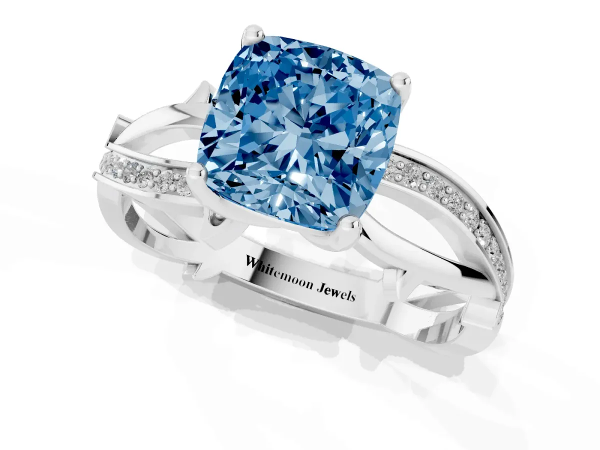 Fancy Blue Cushion Cut Solitaire Twist Band with Pavé Accents and Four-Prong Setting Silver