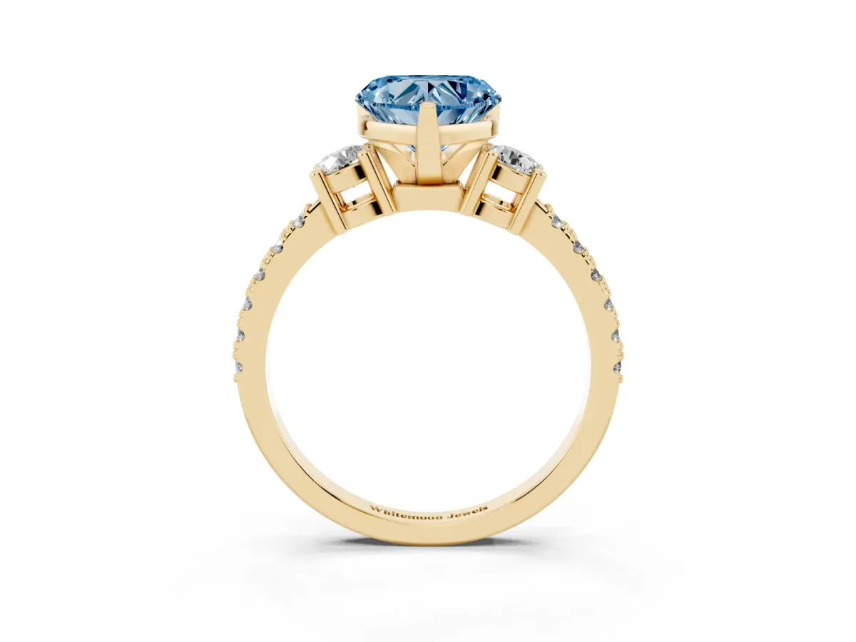 Fancy Blue Heart Cut Three-Stone Diamond Pavé Band with Prong Setting Yellow gold