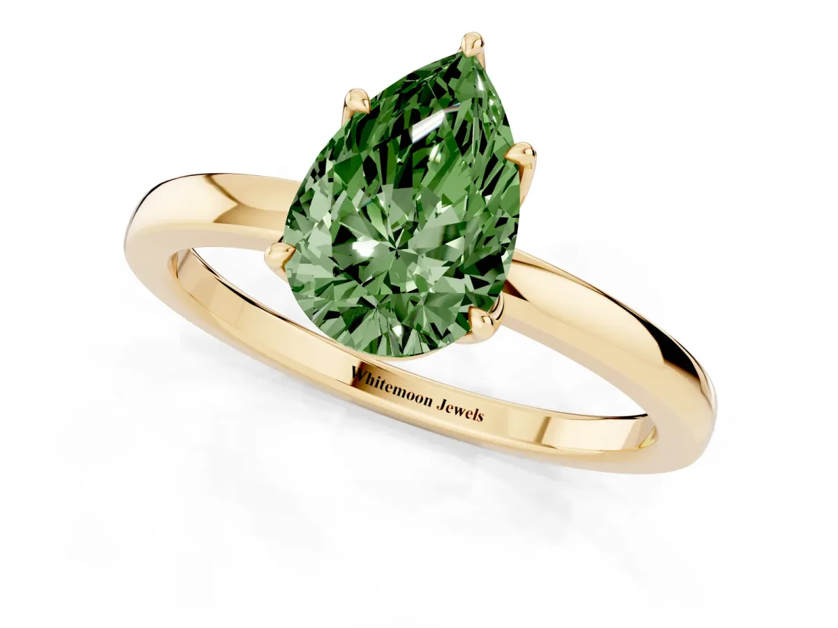 Fancy Green Pear Cut Diamond Solitaire Ring with Thin Band and Prong Setting Yellow gold