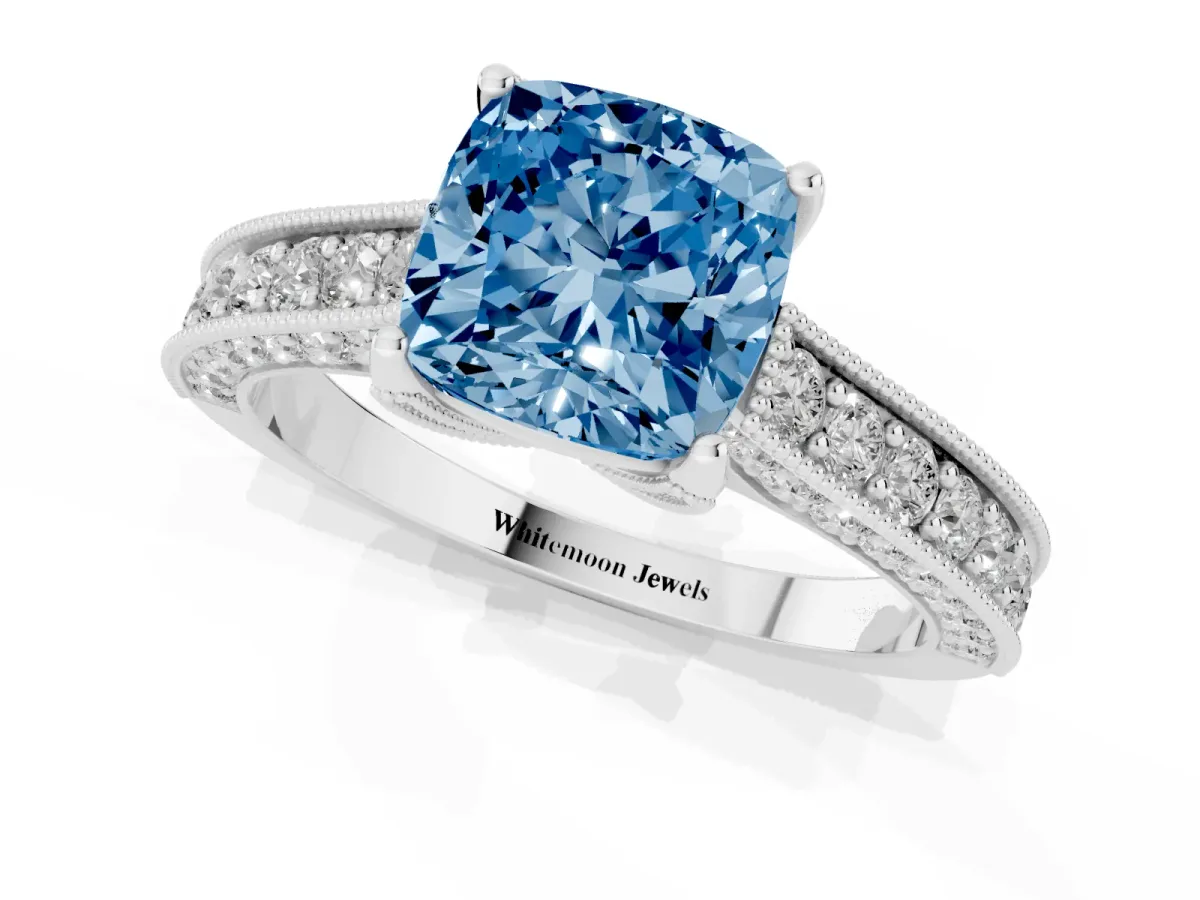 Fancy Blue Cushion Cut Cut Diamond Solitaire Ring with Milgrain Pave Band and Four Prong Setting Silver