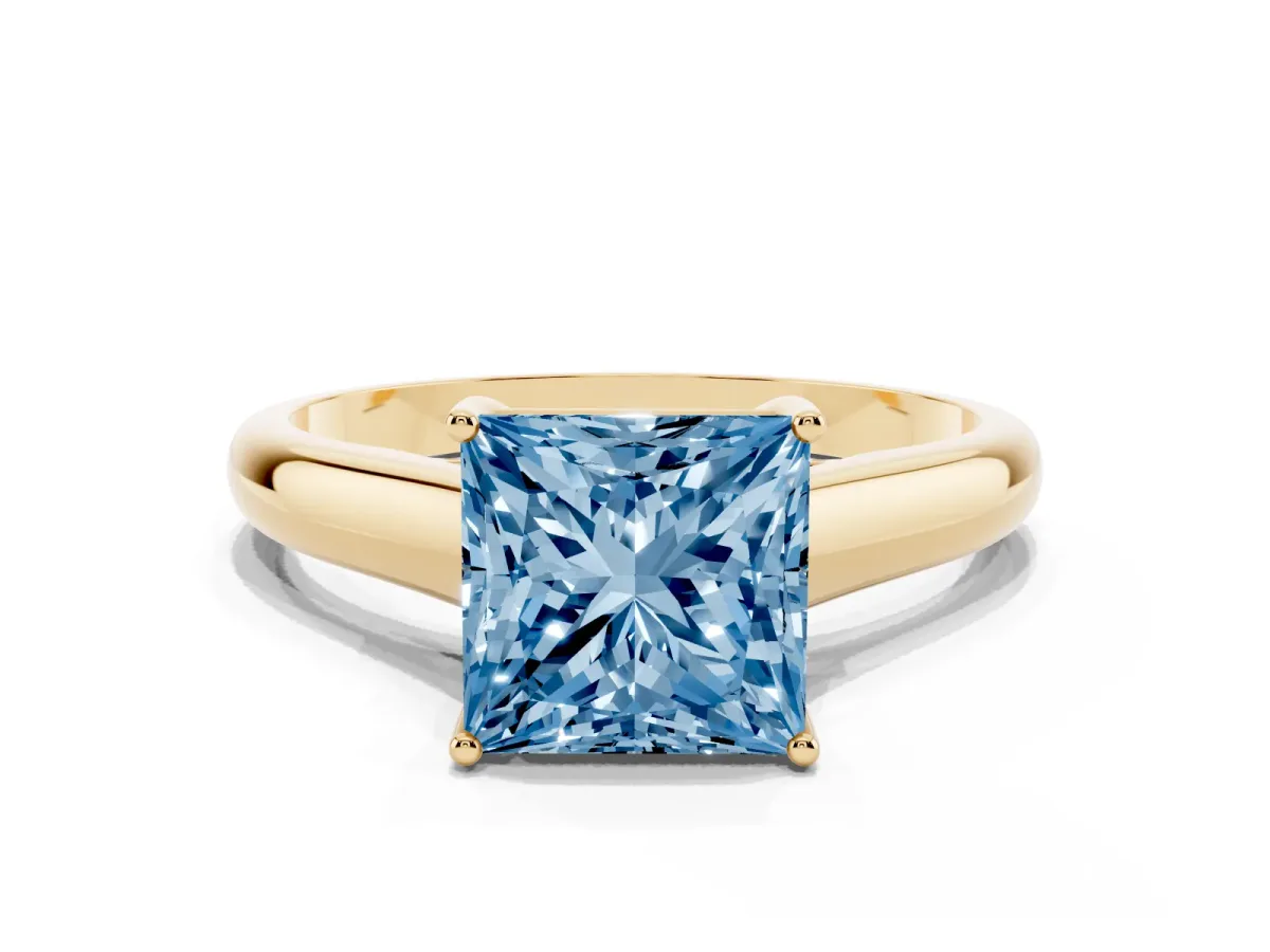 Fancy Blue Princess Cut Solitaire Engagement Ring with Tapered Band and Four-Prong Setting Yellow gold