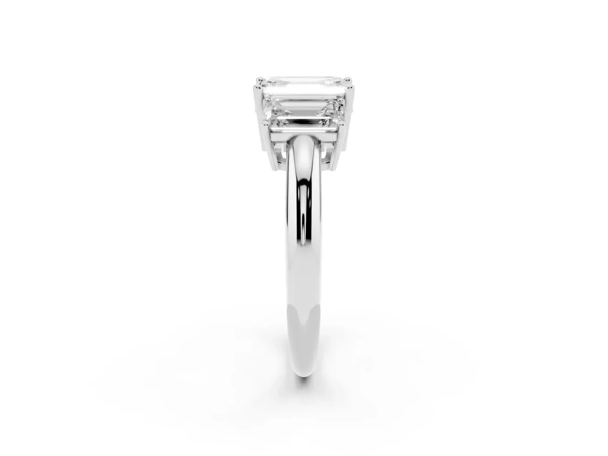 Three-Stone Emerald Cut Cut Diamond Engagement Ring with Prong Setting on a White Gold Band Platinum