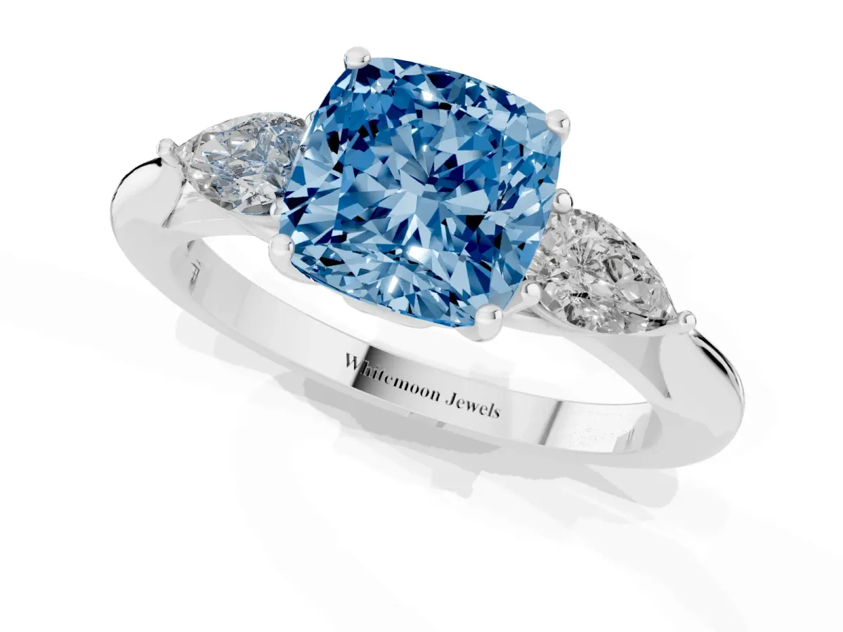 Fancy Blue Three-Stone Cushion Cut Brilliant Diamond Solitaire Ring with Tapered Band and Four-Prong Setting Silver