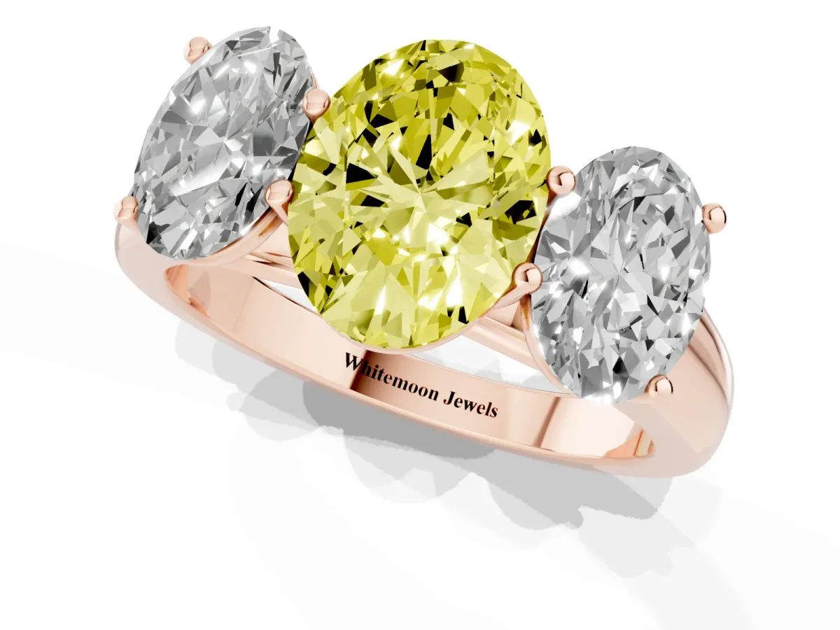 Fancy Yellow Oval Cut Three-Stone Diamond Ring with Prong Setting on a Classic Band Rose gold