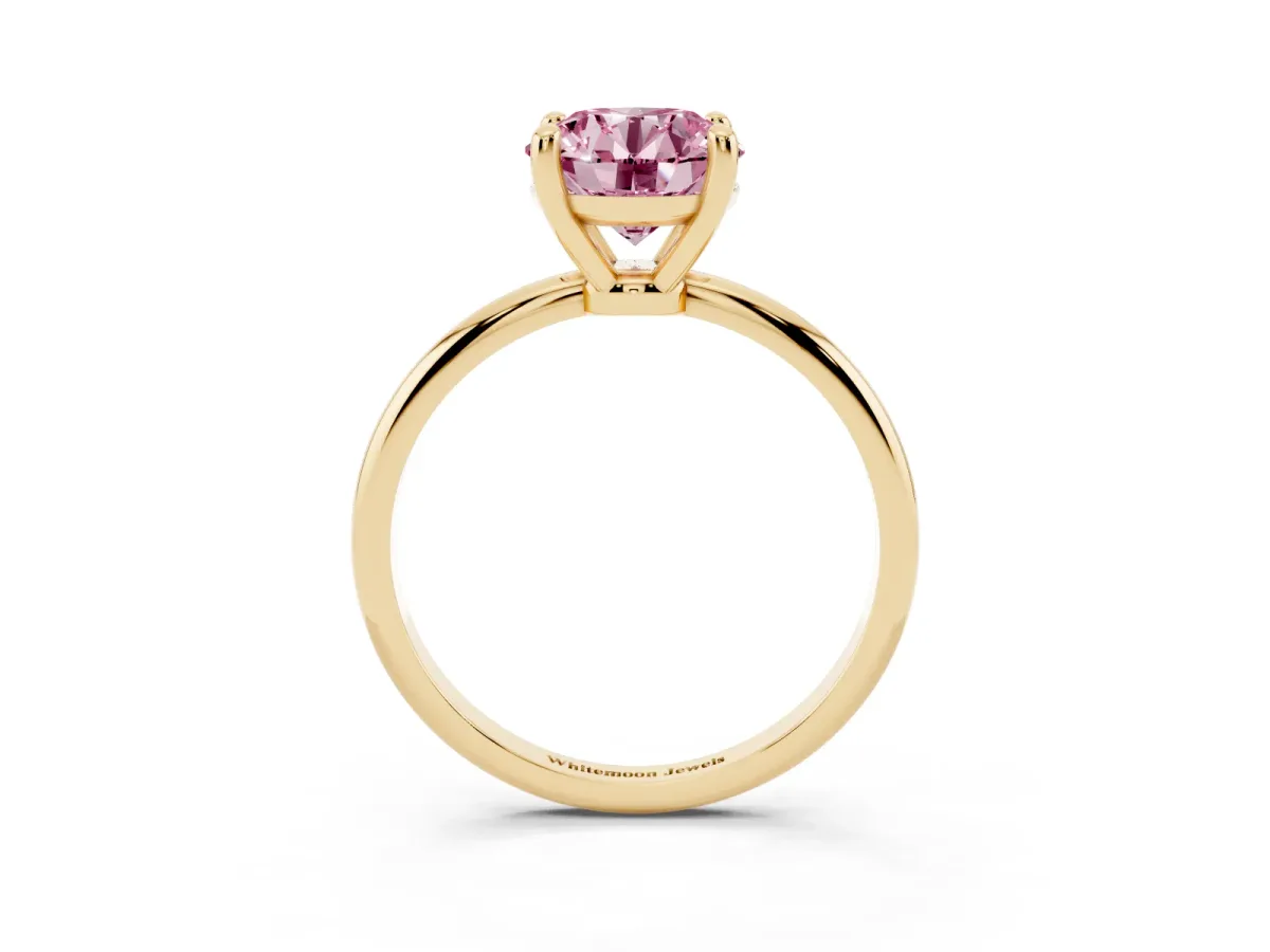 Fancy Pink Round Cut Solitaire Diamond Ring with 4-Prong Setting on a Classic Band Yellow gold