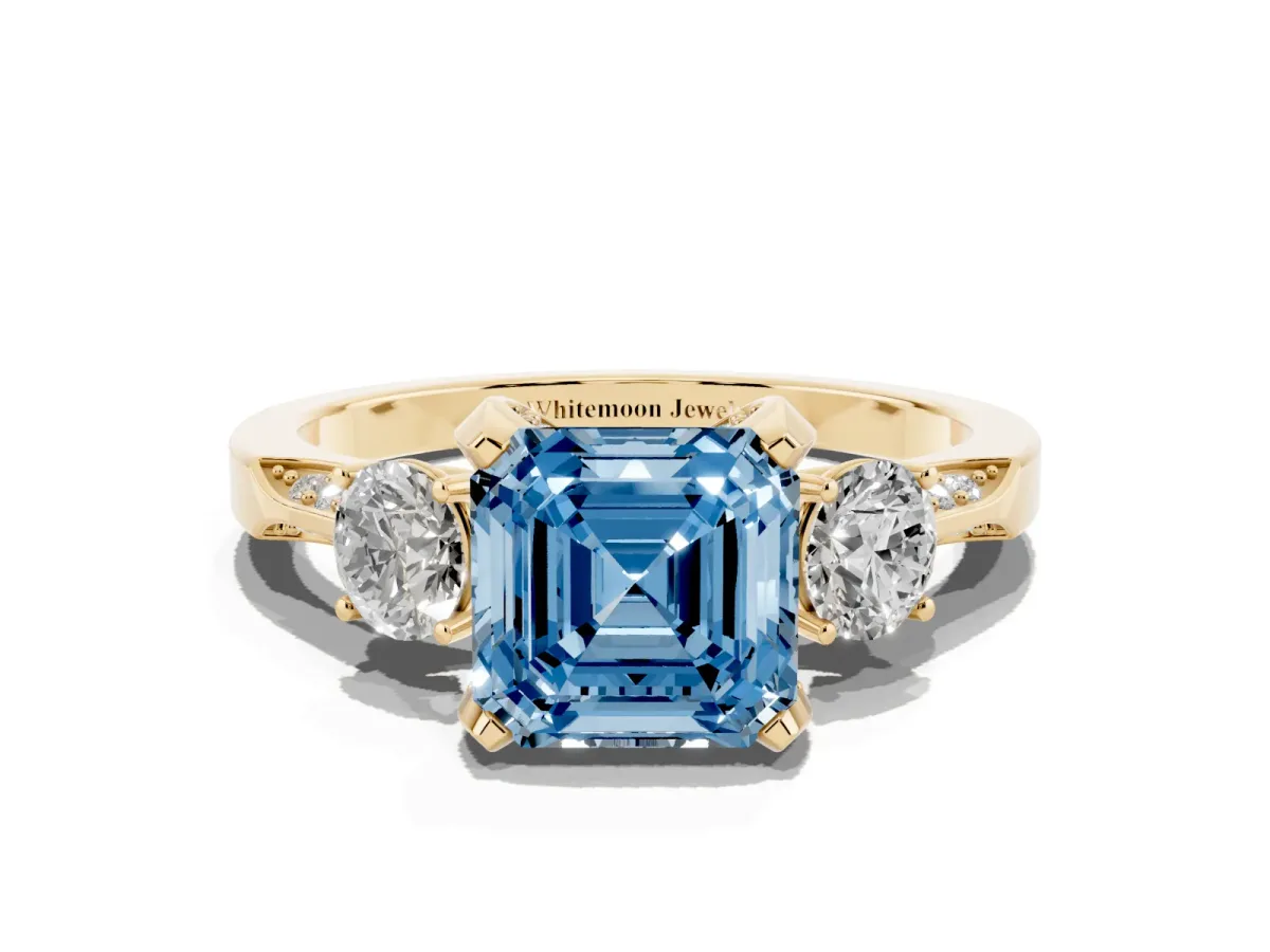 Fancy Blue Asscher Cut Brilliant Three-Stone Diamond Ring with Pavé Band and Four-Prong Setting Yellow gold