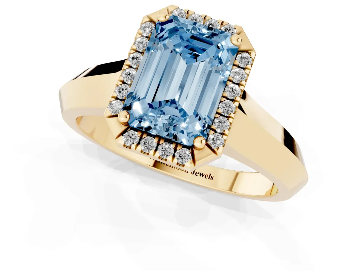 Fancy Blue Emerald Cut Halo Diamond Ring with Cathedral Band and Four-Prong Setting Yellow gold