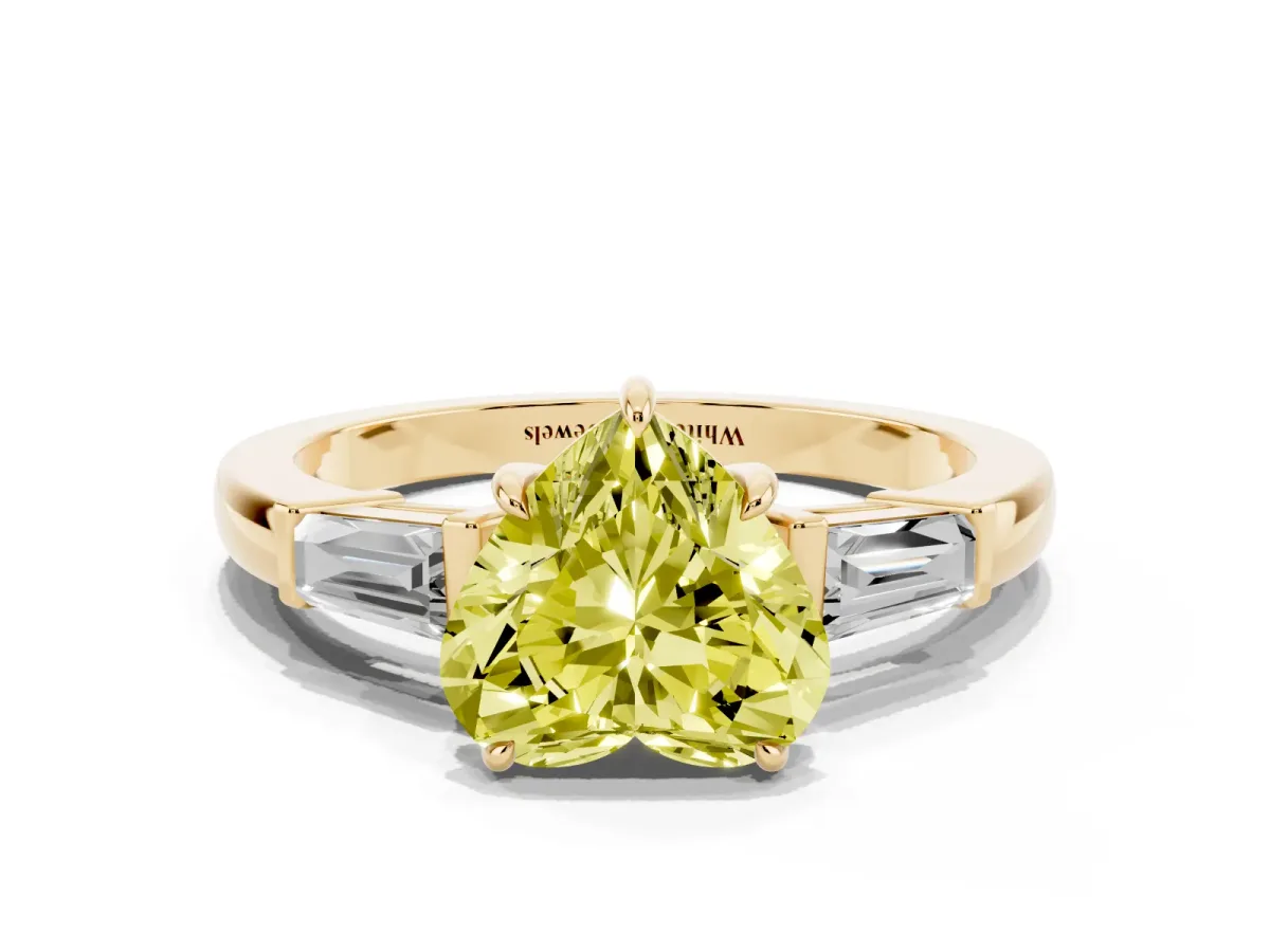 Fancy Yellow Heart Cut Diamond Three-Stone Ring with Tapered Baguette Side Stones and Prong Setting Yellow gold