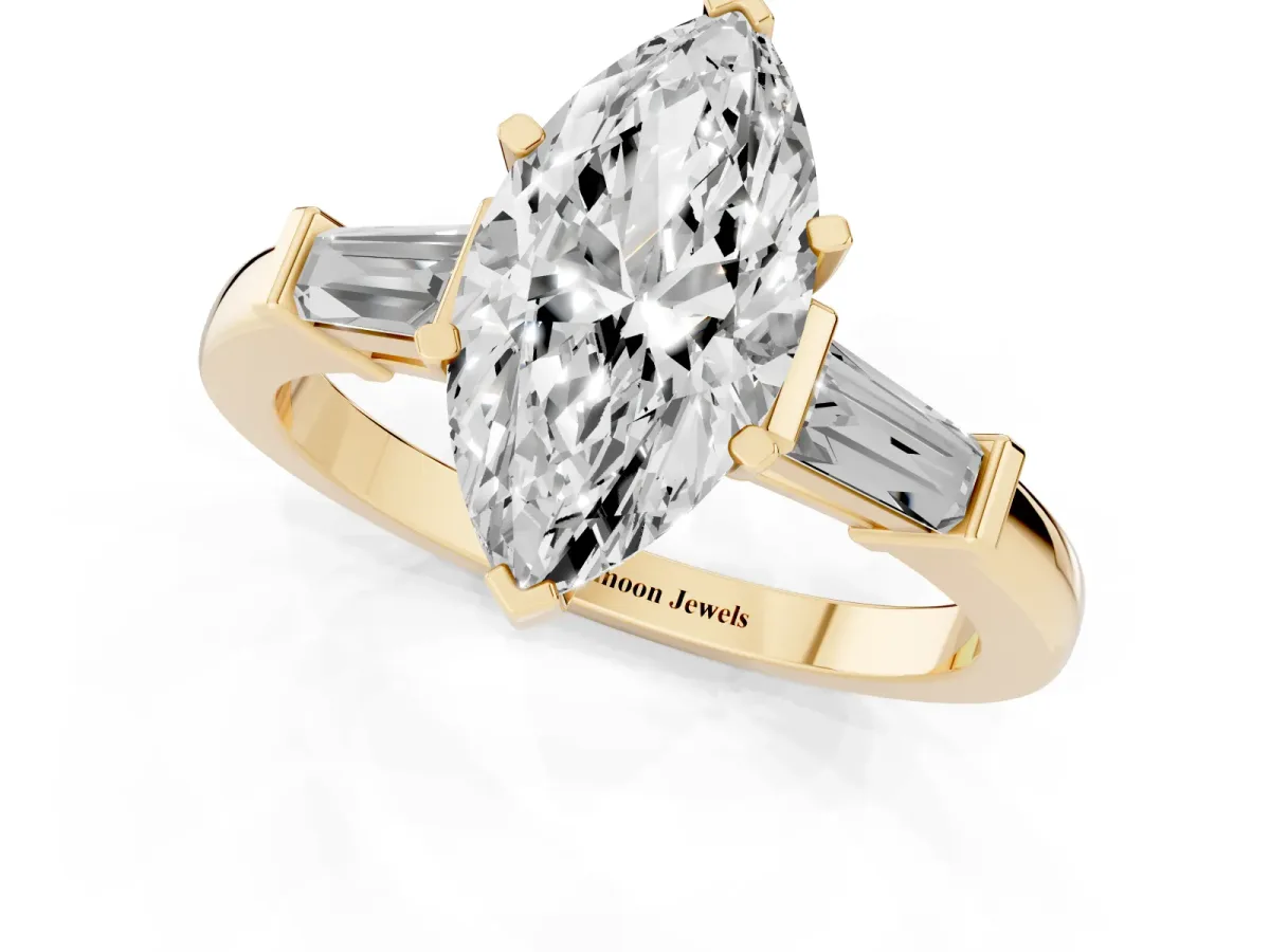 Marquise Cut Cut Diamond Solitaire Ring with Tapered Baguette Accents and Four-Prong Setting Yellow gold
