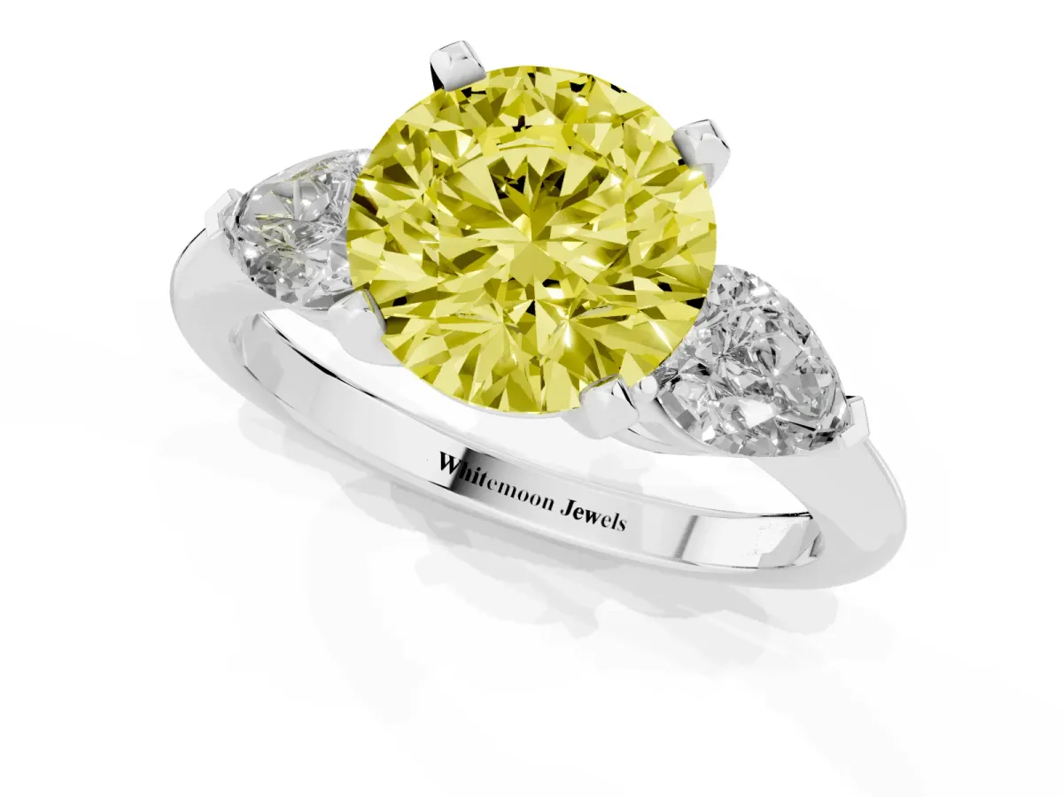 Fancy Yellow Three-Stone Round Cut Diamond Ring with Pear Side Stones and Four-Prong Setting Platinum