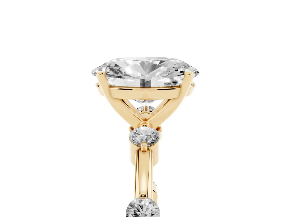 Oval Cut Solitaire Diamond Ring with Bezel Set Side Stones and Prong Setting Yellow gold