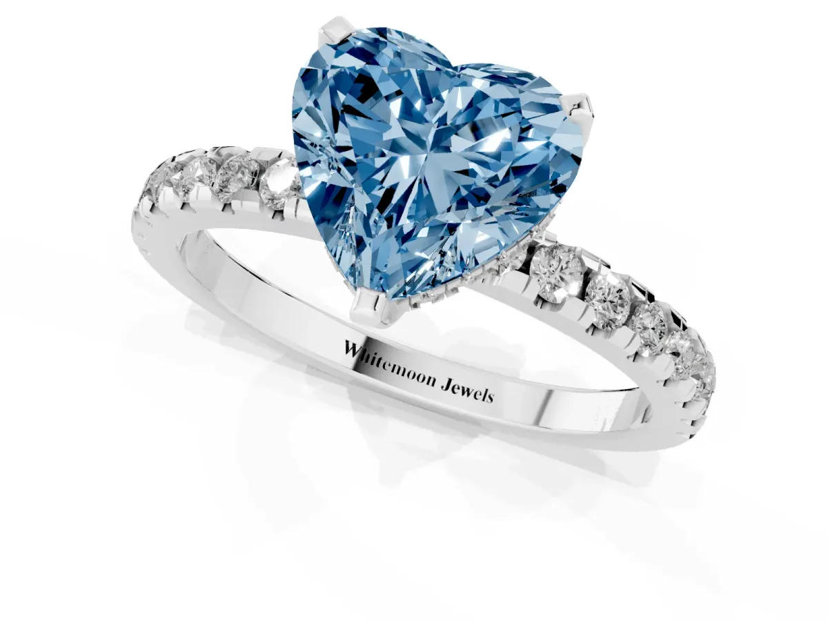 Fancy Blue Heart Cut Diamond Solitaire Ring with Round Pavé Band and Four-Prong Setting Silver