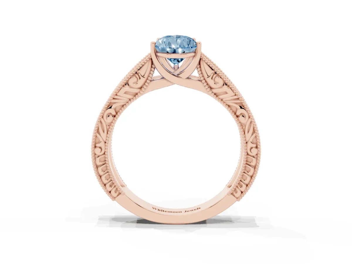 Fancy Blue Pear Cut Diamond Solitaire Ring with Engraved Band and Four-Prong Setting Rose gold