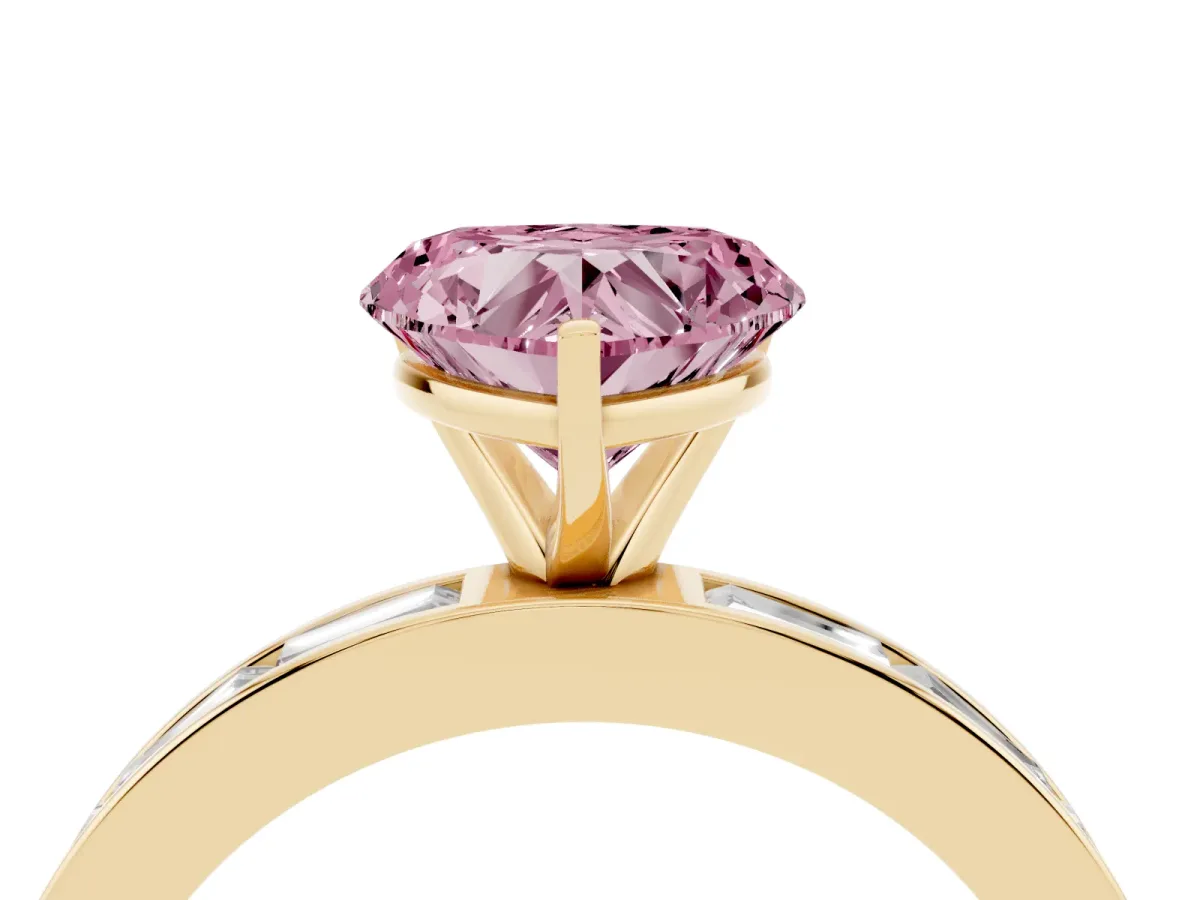 Fancy Pink Heart Cut Solitaire Diamond Ring with Channel-Set Baguette Band and Four-Prong Setting Yellow gold