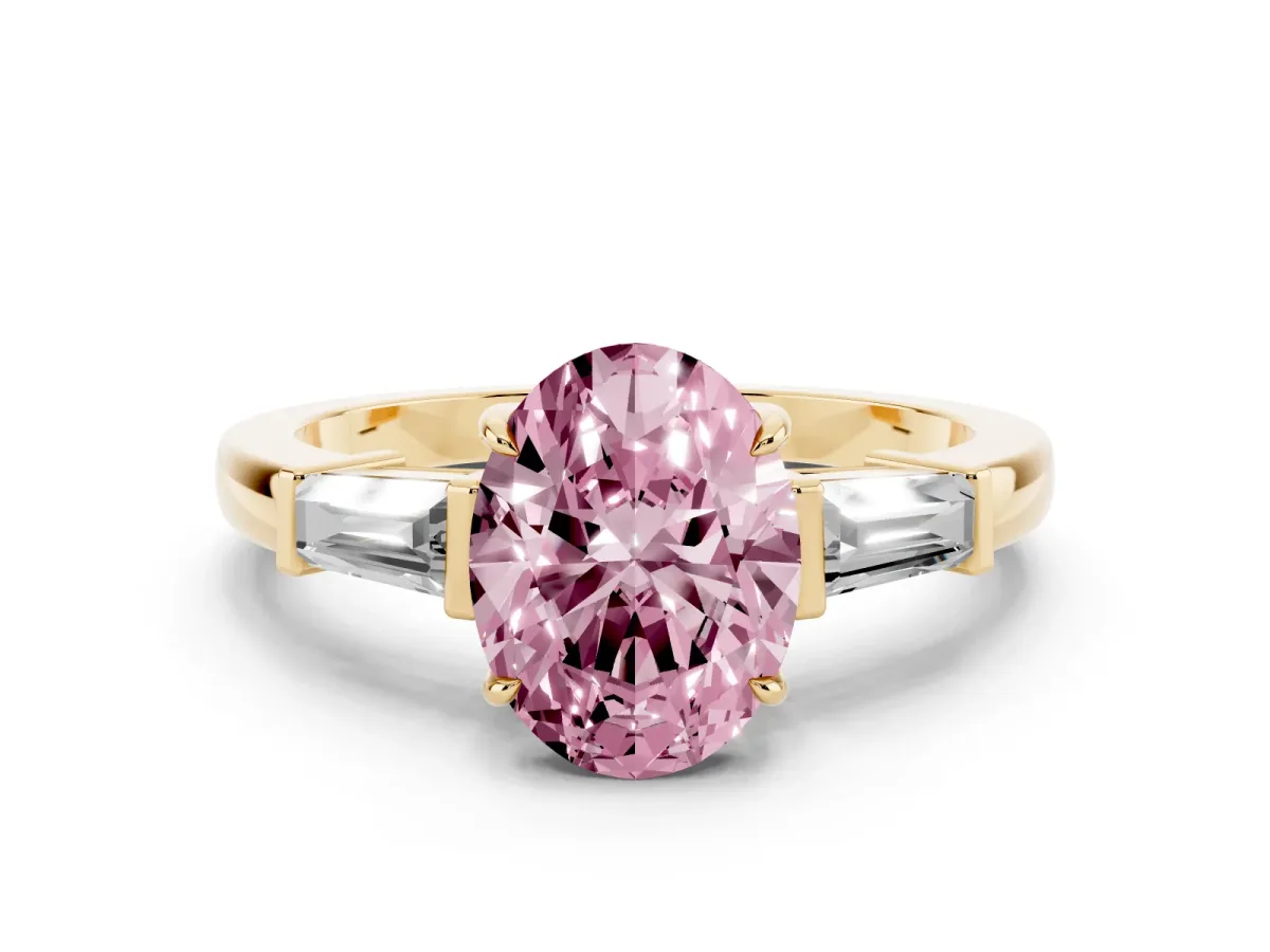 Fancy Pink Oval Cut Diamond Three-Stone Ring with Tapered Baguette Side Stones and Prong Setting Yellow gold