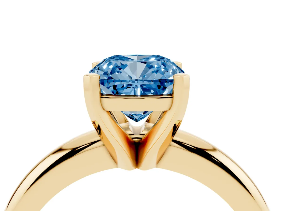Fancy Blue Cushion Cut Diamond Solitaire Engagement Ring with Round Band and Four-Prong Setting Yellow gold