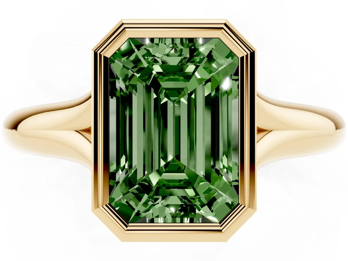 Fancy Green Bezel Set Emerald Cut Solitaire Diamond Ring with Smooth Band Yellow gold