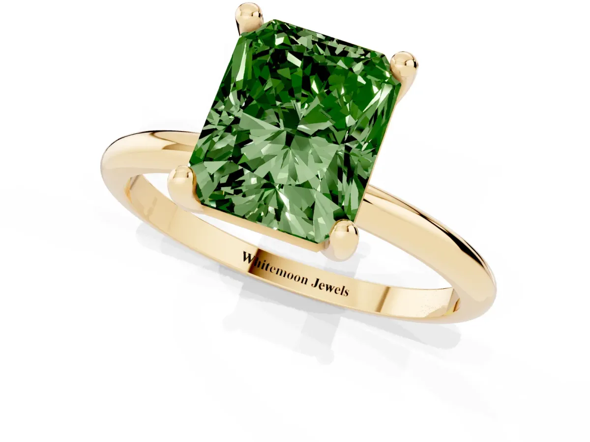 Fancy Green Radiant Cut Solitaire Diamond Ring with 4-Prong Setting on a Classic Band Yellow gold