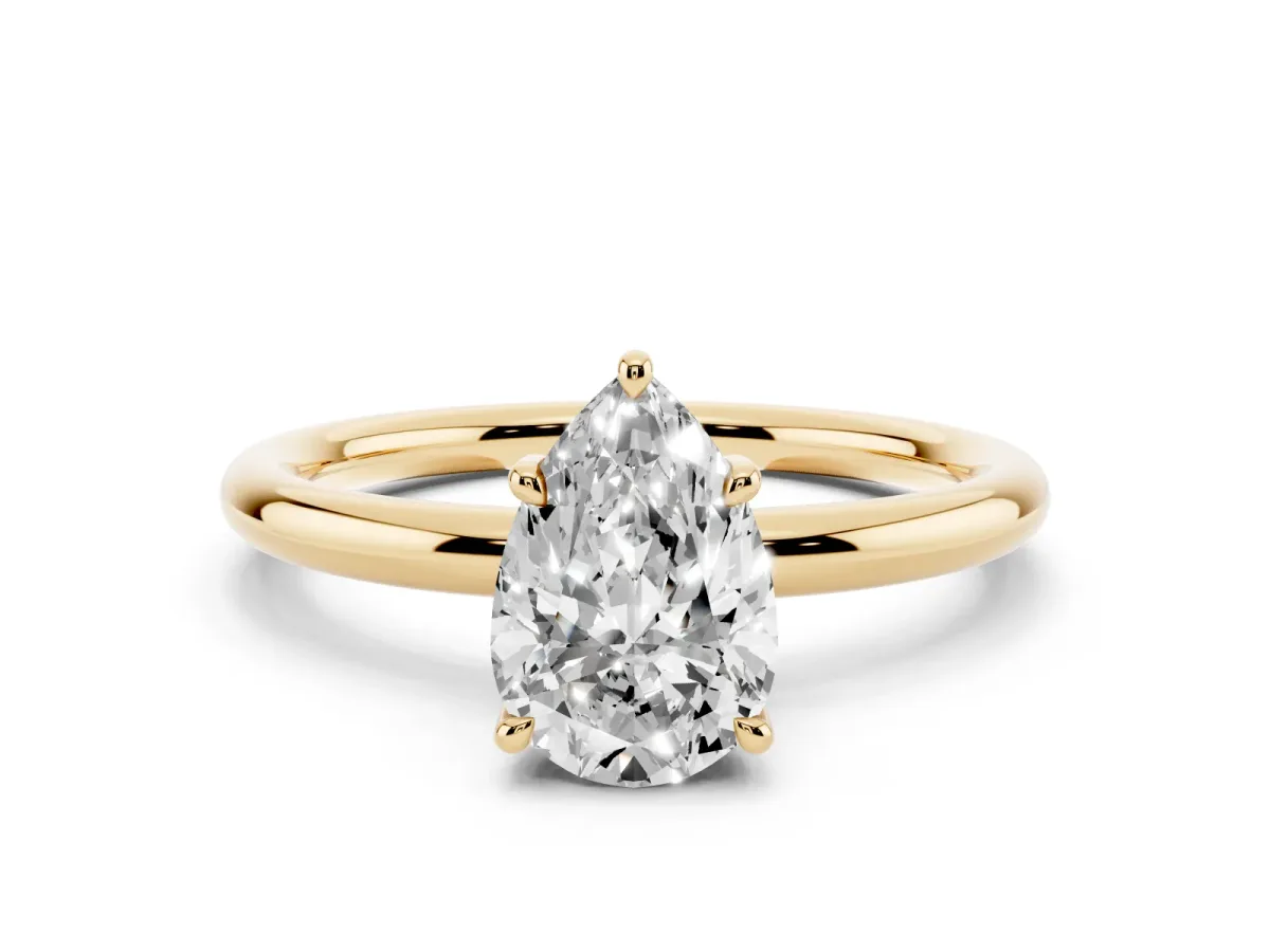 Pear Cut Diamond Solitaire Ring with Thin Band and Four-Prong Setting Yellow gold