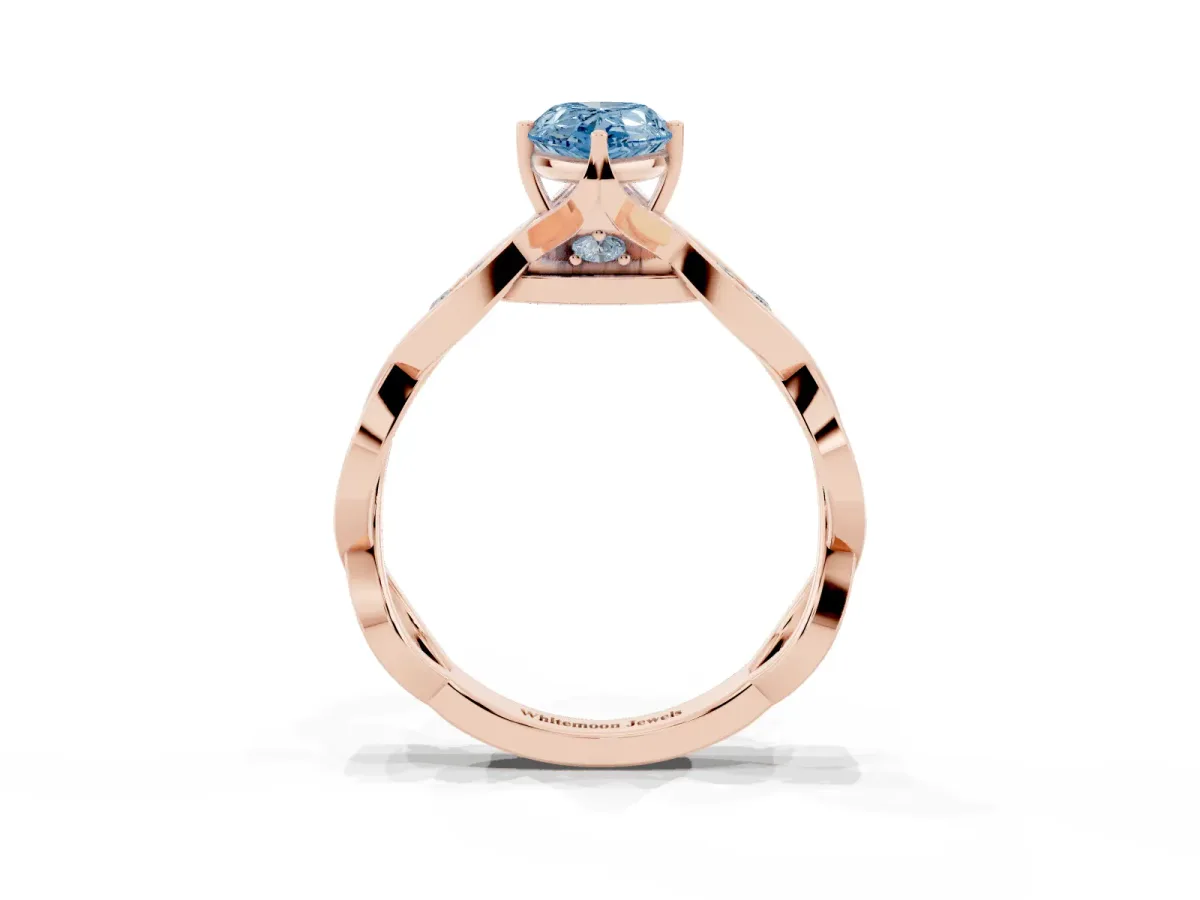 Fancy Blue Pear Cut Solitaire Twist Band with Leaf Prong Setting Rose gold