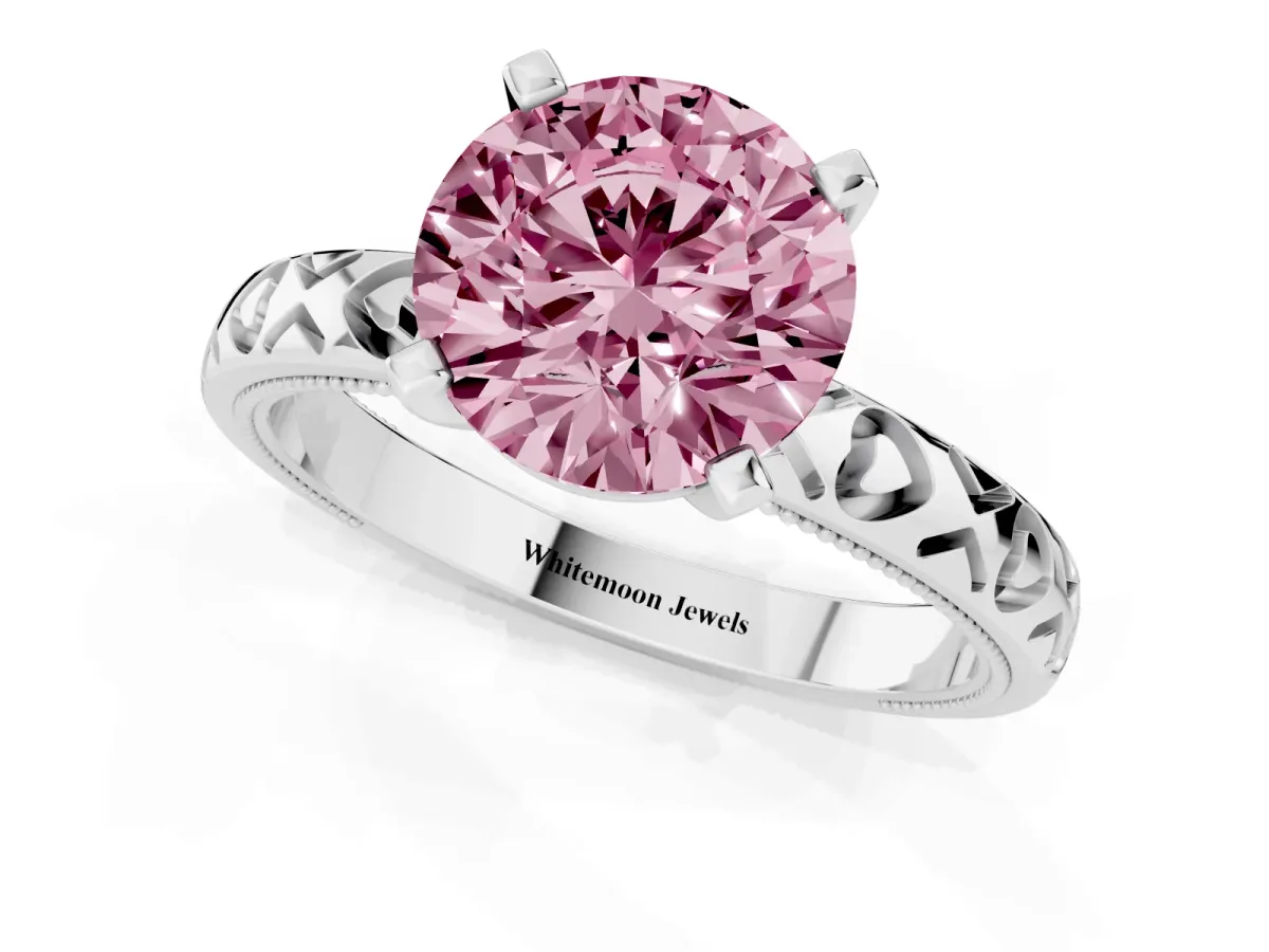Fancy Pink Round Cut Solitaire Diamond Engagement Ring with XO Engraved Band and Four-Prong Setting Silver