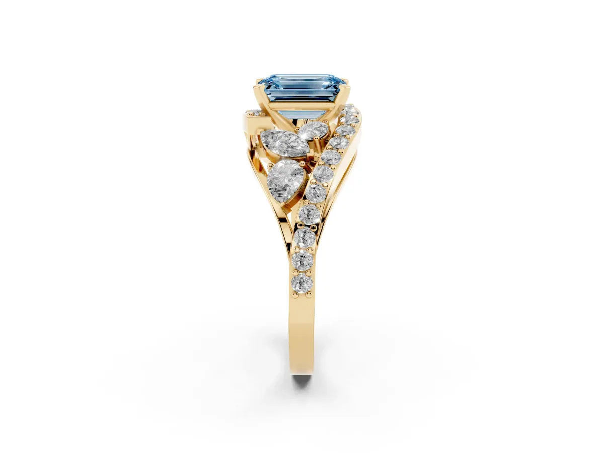 Fancy Blue Emerald Cut Diamond Halo Ring with Marquise and Pavé Band in Prong Setting Yellow gold