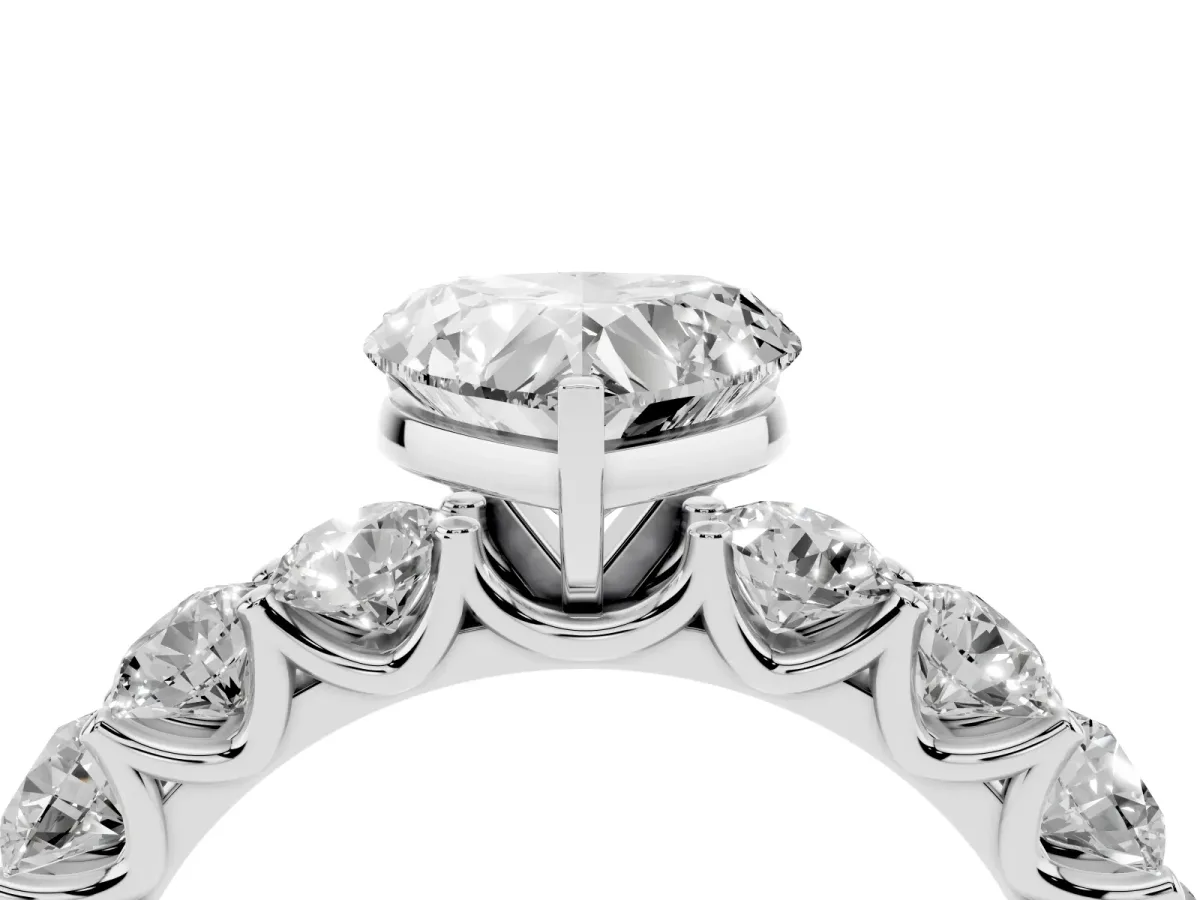 Heart Cut Diamond Prong Setting with Side Stones on a Pave Band Silver