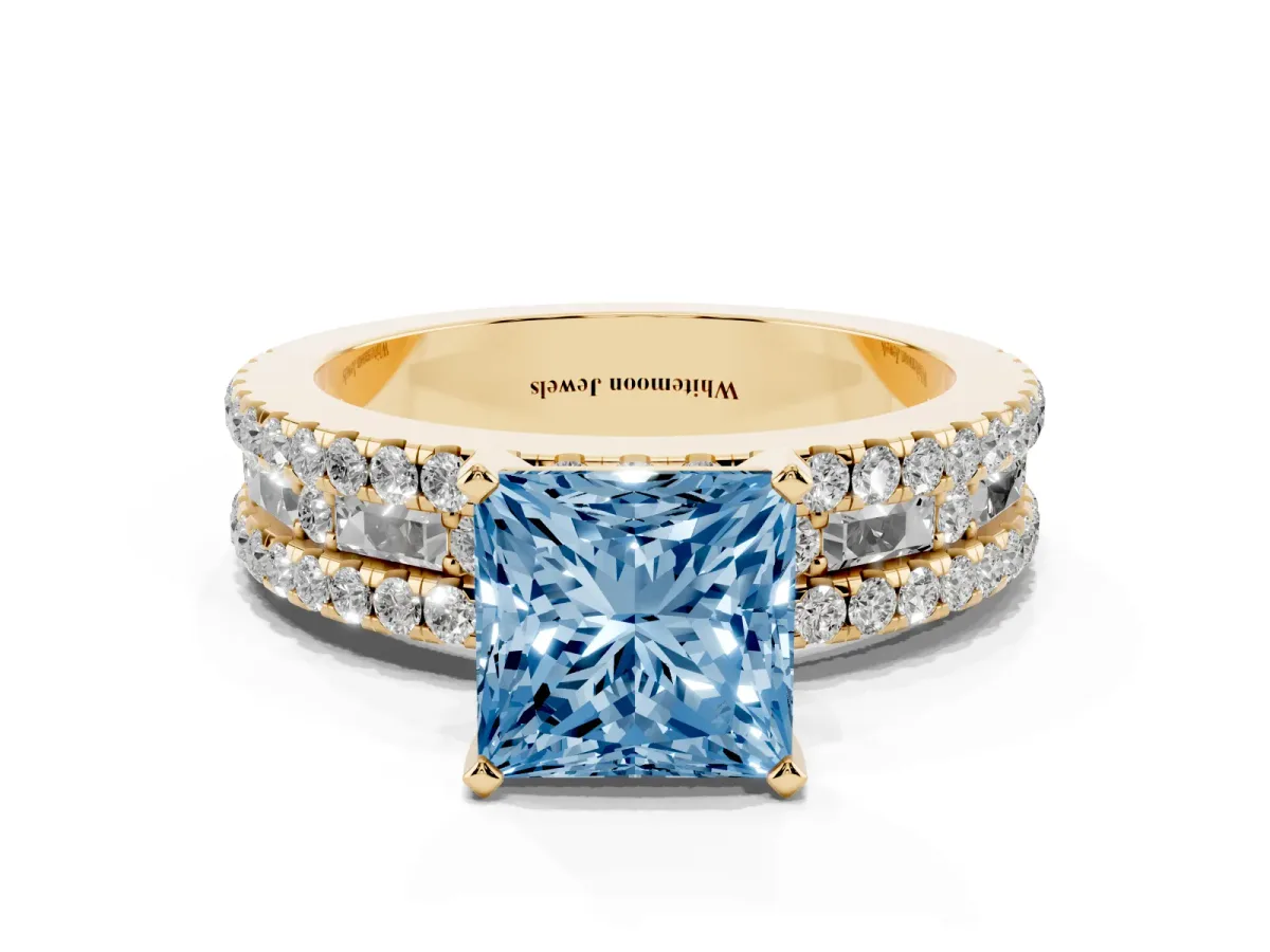 Fancy Blue Princess Cut Diamond Solitaire Ring with Pavé and Channel Set Band Yellow gold