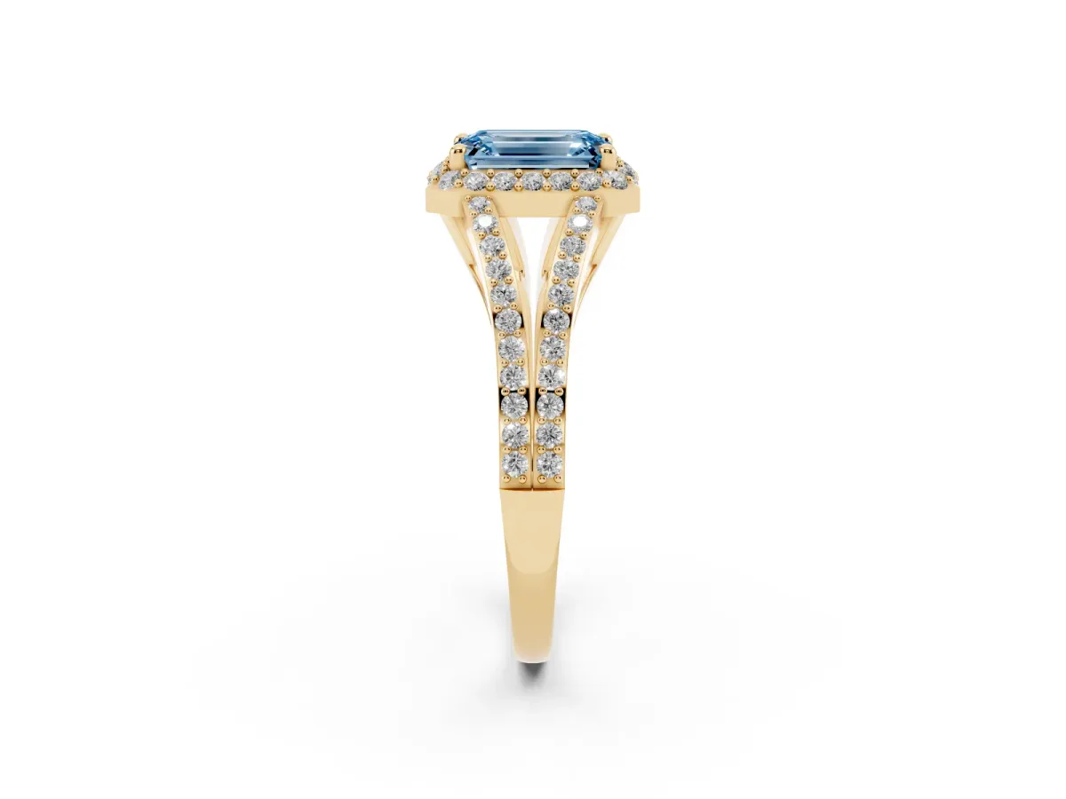 Fancy Blue Emerald Cut Halo Split Shank Pave Diamond Ring with Four-Prong Setting Yellow gold