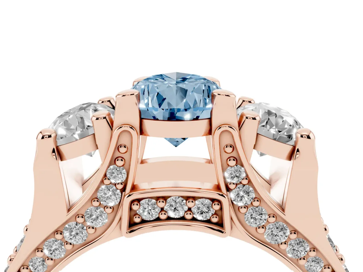 Fancy Blue Pear Cut Diamond Three-Stone Ring with Channel Set Band and Four-Prong Setting Rose gold