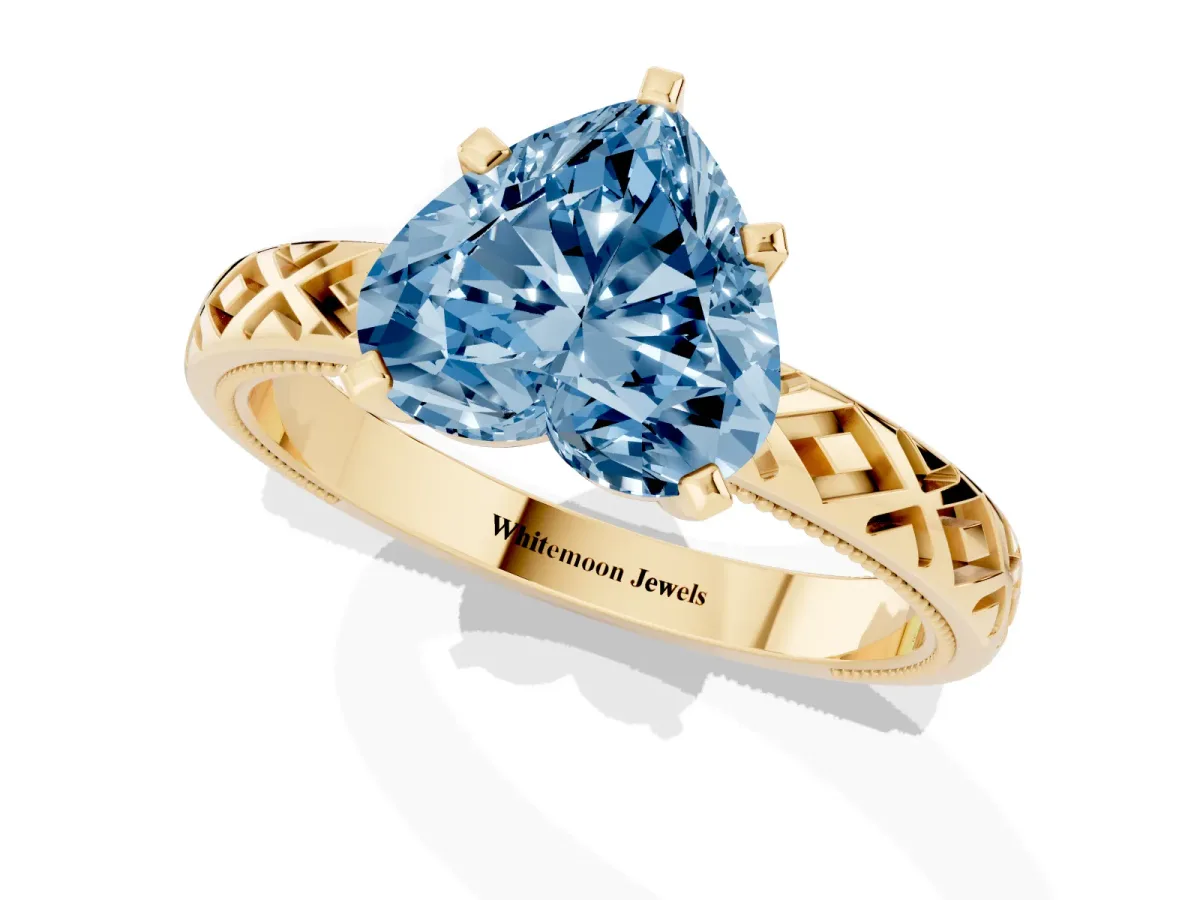 Fancy Blue Heart Cut Solitaire Diamond Ring with Milgrain and Black Enamel X Pattern Band Yellow gold
