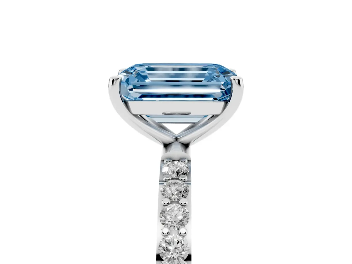Fancy Blue Emerald Cut Diamond Solitaire Ring with Round Pavé Shoulders and Prong Setting Platinum
