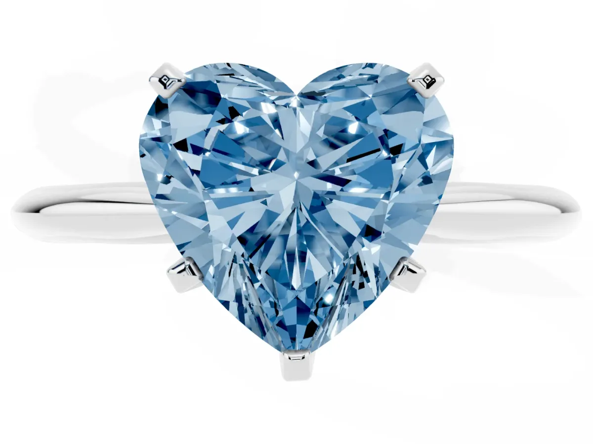 Fancy Blue Heart Cut Cut Solitaire Ring with Four-Prong Setting on a Classic Band Silver