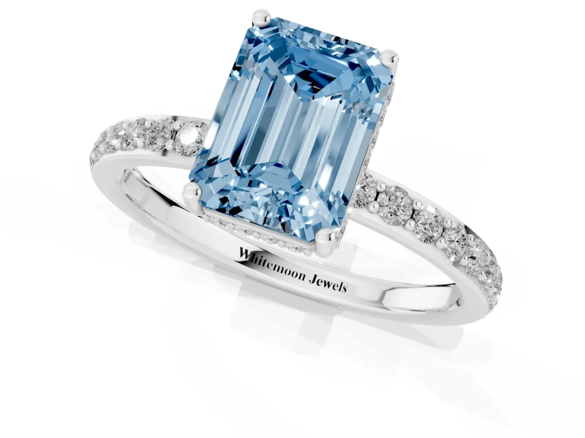 Fancy Blue Emerald Cut Diamond Solitaire Ring with Pavé Band and Hidden Halo White gold