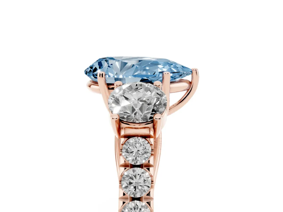 Fancy Blue Pear Cut Cut Diamond Three-Stone Ring with Round Side Stones and Pavé Band Rose gold