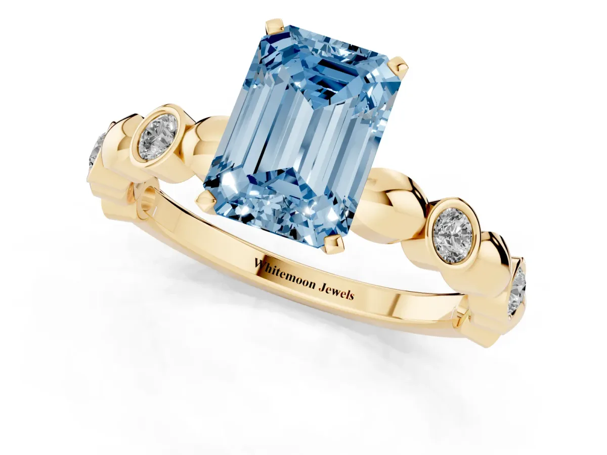 Fancy Blue Emerald Cut Solitaire Bezel-Set Diamond Ring with Beaded Band and Four-Prong Setting Yellow gold