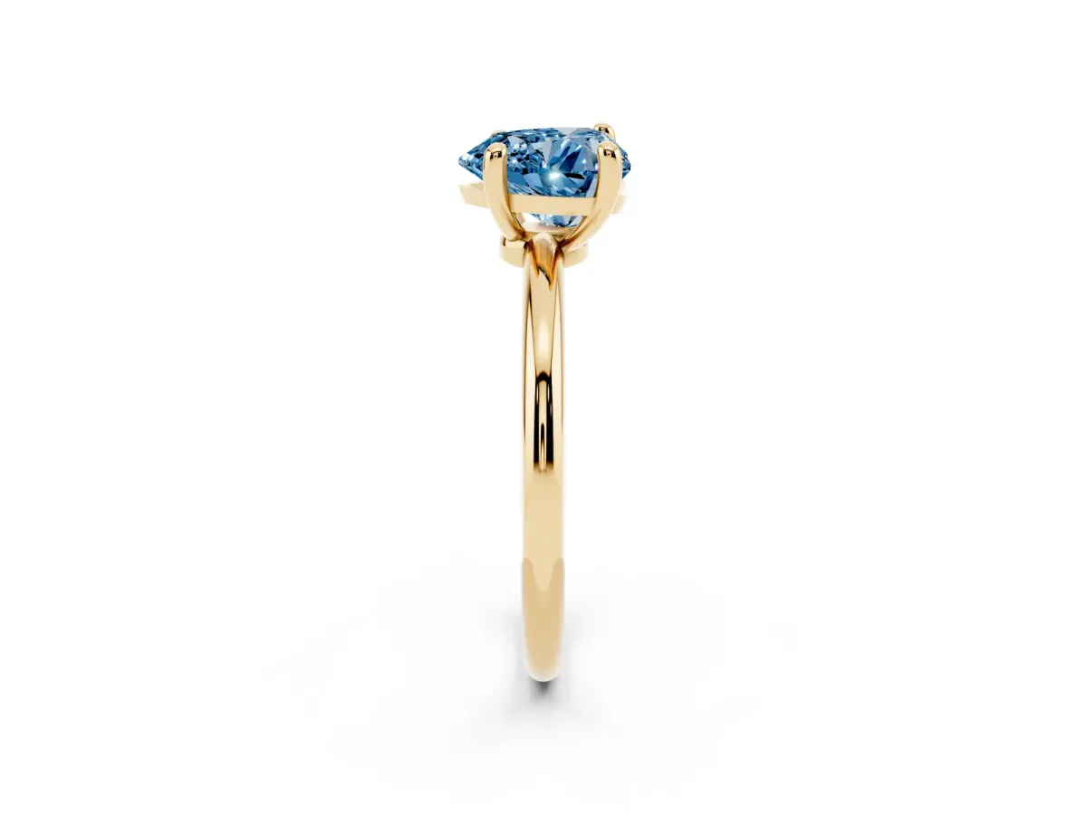 Fancy Blue Heart Cut Solitaire Diamond Ring with 4-Prong Setting on a Classic Band Yellow gold