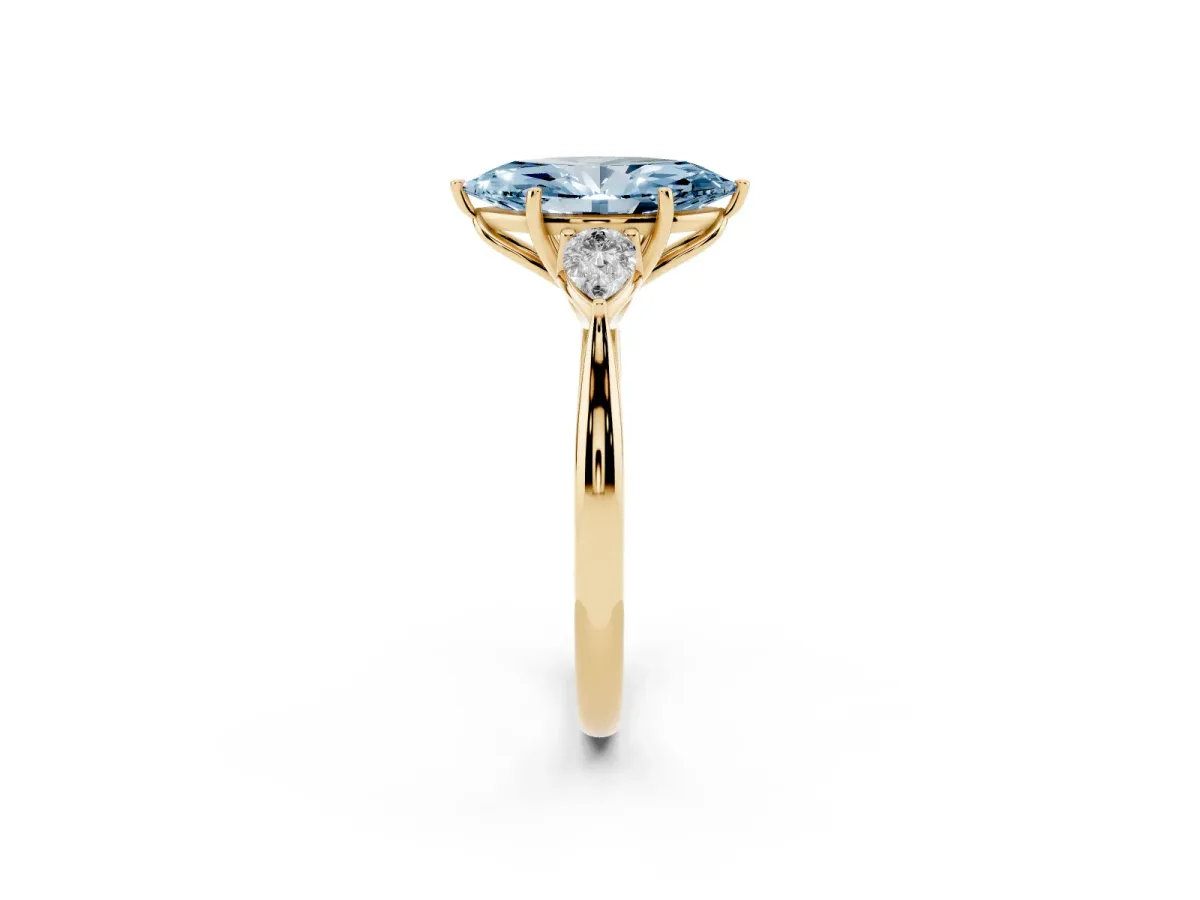 Fancy Blue Three-Stone Marquise Cut Brilliant Diamond Solitaire Ring with Tapered Band and Four-Prong Setting Yellow gold